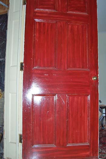 Federal style closet door with inexpensive mahogany-like stain.