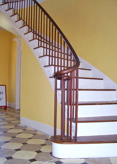 Curved, thin Federal Style banisters and balusters in James Vanderpool House, Kinderhook, New York. 